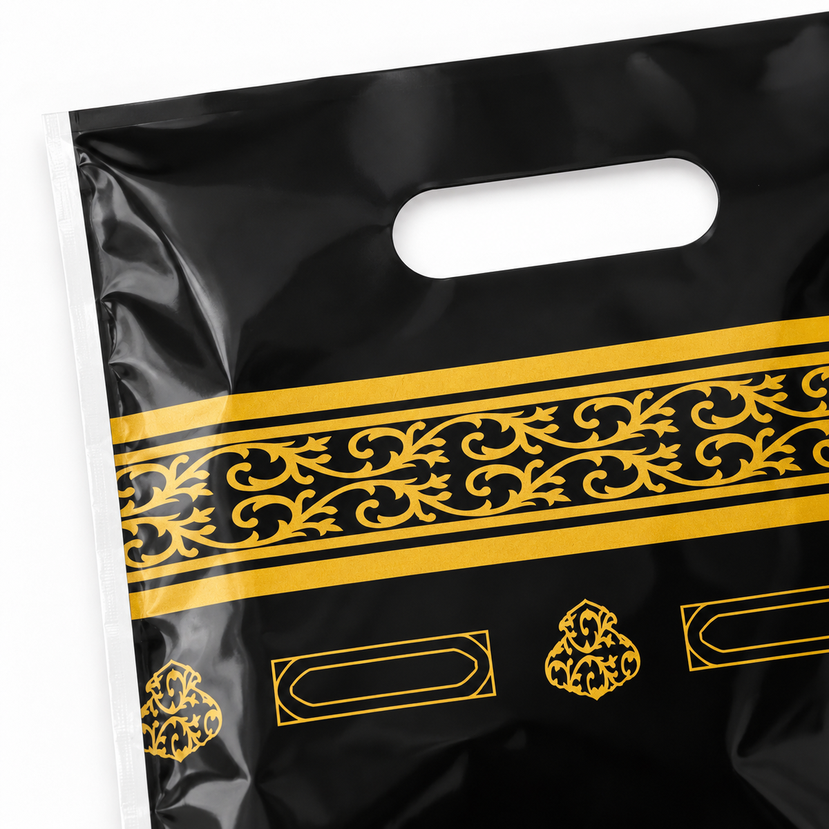 Detail gouden ornamenten en handvat van traktatiezakje